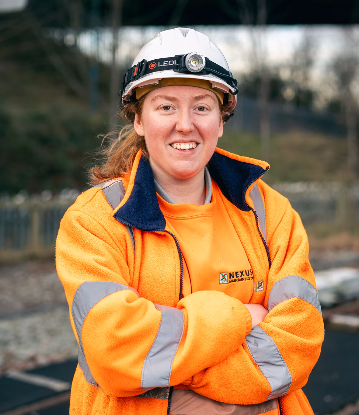 A Nexus colleague in hi vis and helmet