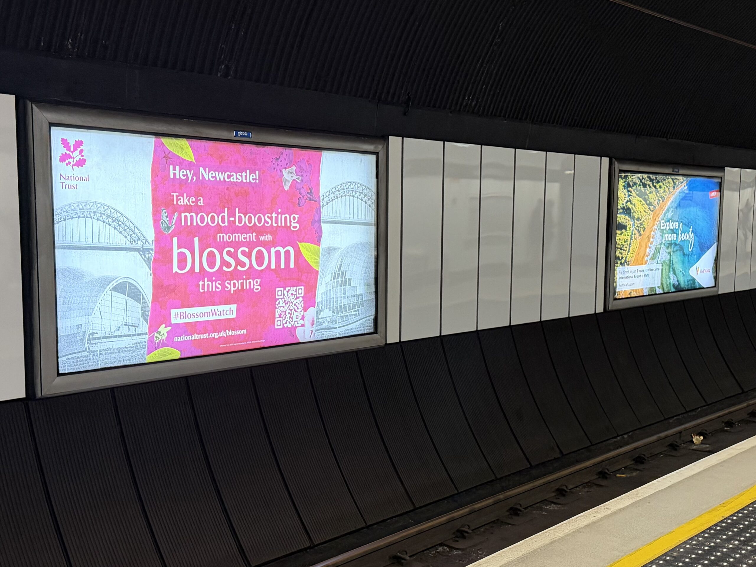 Image of large advertising boards at a Metro station