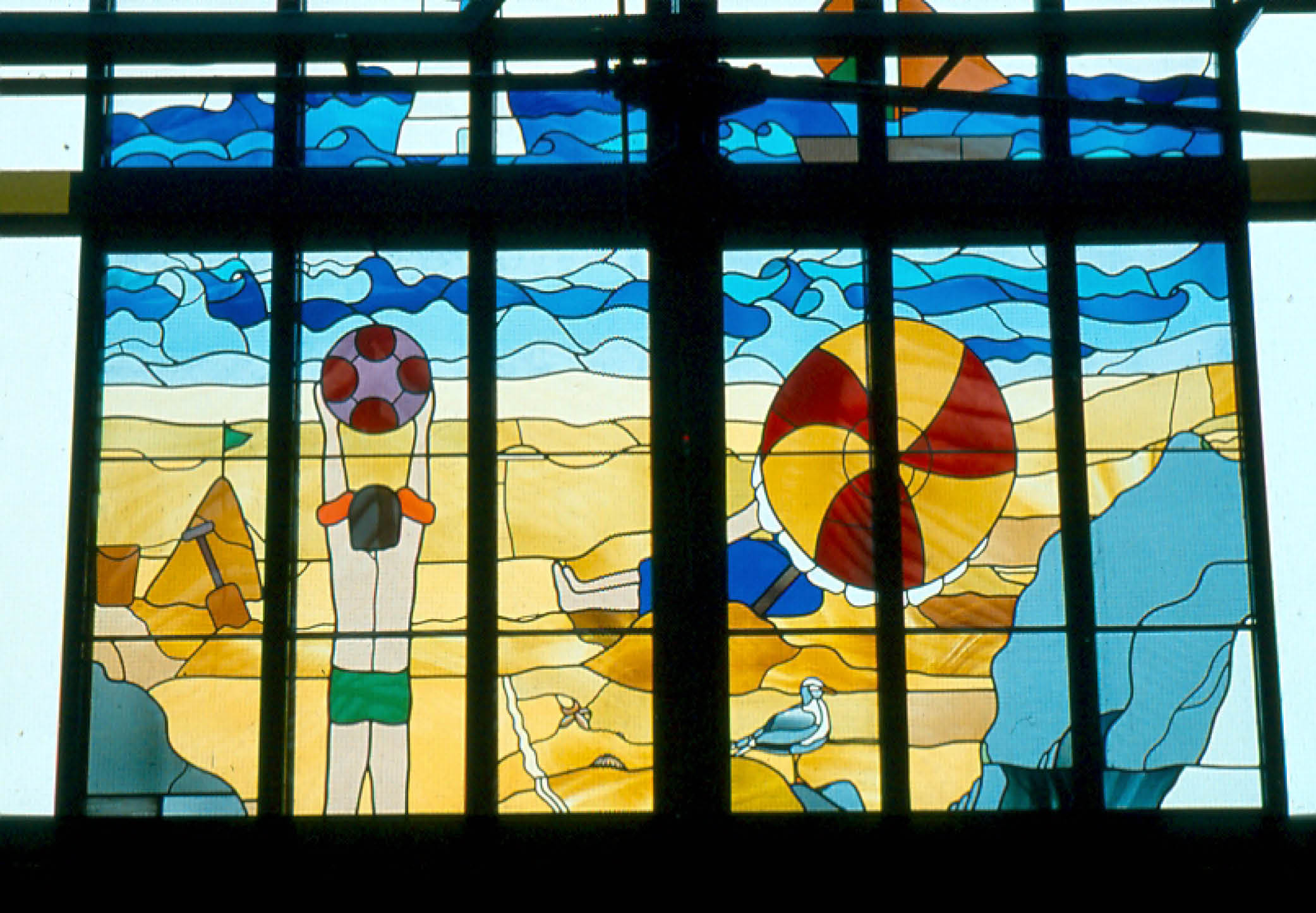 An image of a beach in stained glass